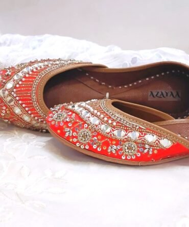 Reddish orange handcrafted jutti with mirror and pearl embroidery
