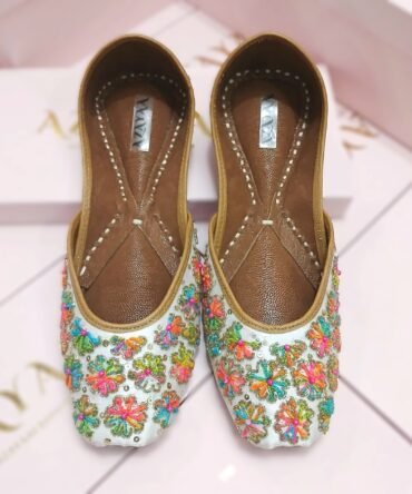 Harnaaz multicolor hand-embroidered jutti with vibrant floral threadwork by Azayaa
