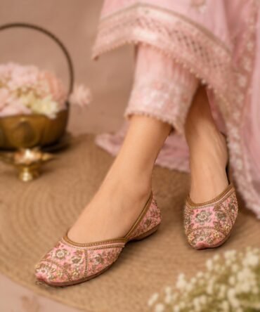 Pink Cherry Blossom juttis with floral embroidery and golden detailing by Azayaa