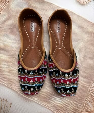 Handcrafted Dastaan juttis featuring layered sequin embroidery