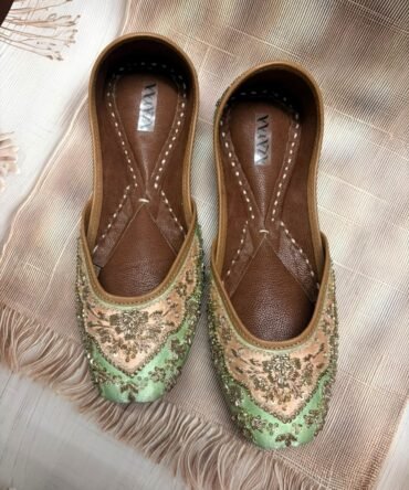 Gulnaar mint green juttis with floral golden embroidery by Azayaa
