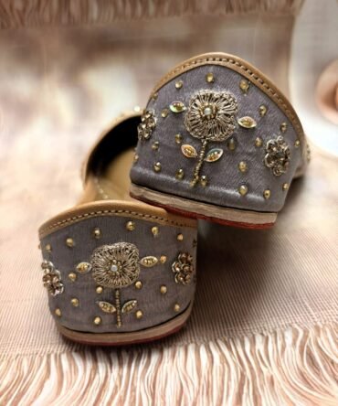 Close-up of Moonlight Punjabi juttis with intricate silver embellishments