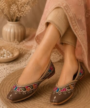 Morni brown juttis with colourful pink blue green embroidery by Azayaa