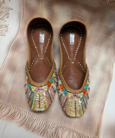 Rangrez multicolour embroidered juttis with vibrant embellishments by Azayaa