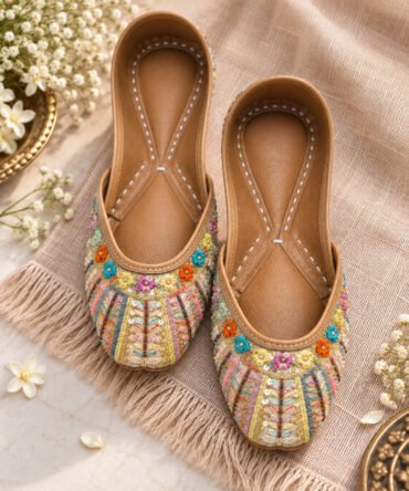 Rangrez multicolour embroidered juttis with vibrant embellishments by Azayaa