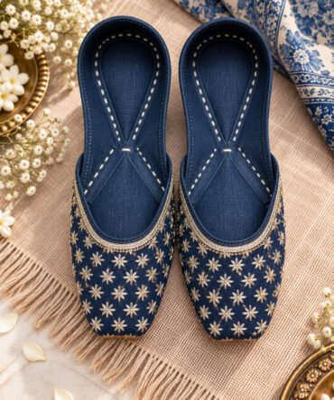 Handcrafted navy blue and gold juttis for women