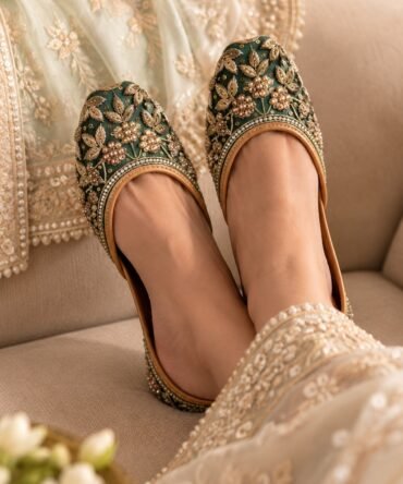 Shehzadi emerald green juttis with rich golden floral embroidery by Azayaa