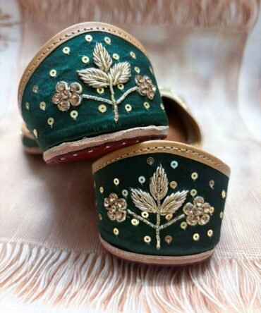 Close-up of green and gold Shehzadi Punjabi juttis