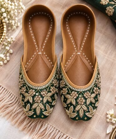 Handcrafted emerald green wedding juttis with golden embellishments