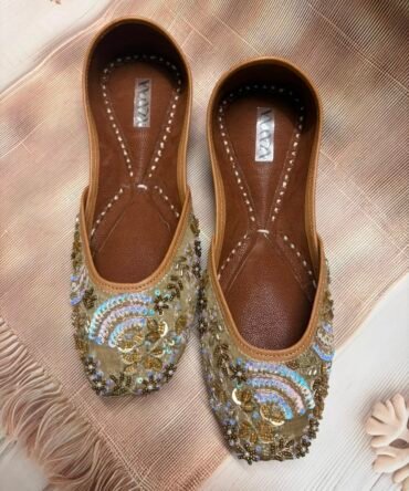 Zohra gold and blue embroidered juttis with paisley detailing by Azayaa