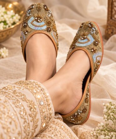 Zohra gold and blue embroidered juttis with paisley detailing by Azayaa